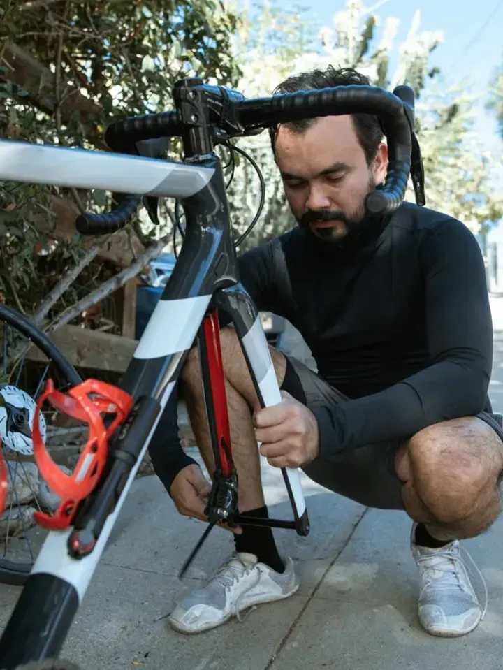A KAMEO Bikes technician preparing a bike in the workshop