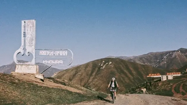 Crossing a mountain pass at dawn during a self-supported bikepacking race