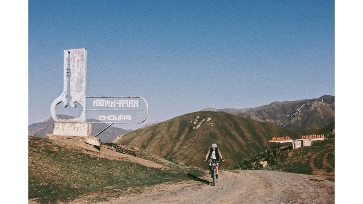 Crossing a mountain pass at dawn during a self-supported bikepacking race