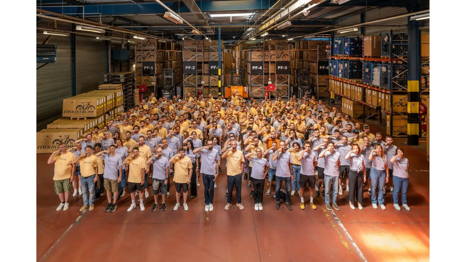 Moustache Bikes staff gathered in the company's warehouse in the Vosges
